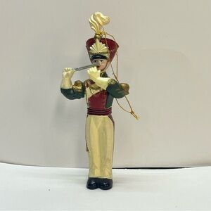 flute player band parade red green ornament christmas holiday
